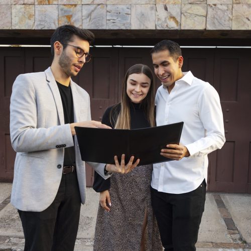 front-view-couple-talking-real-estate-agent